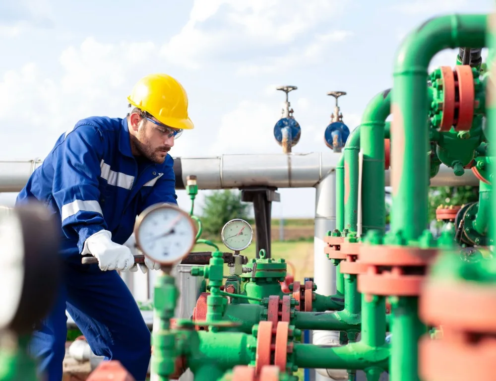 An engineer inspecting a pipe system.